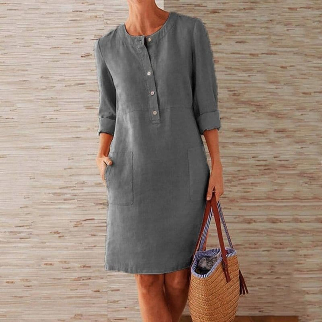 Shirt dress with long sleeves, button-up front, and pockets