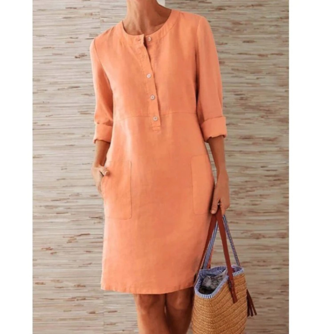 Shirt dress with long sleeves, button-up front, and pockets