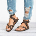 Flat sandals with adjustable buckle straps
