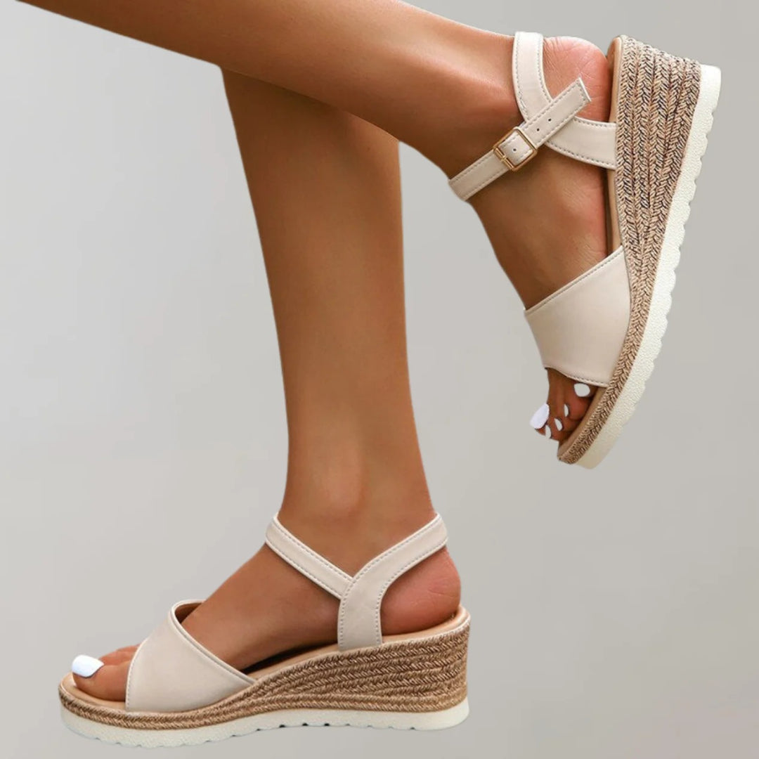 Wedge sandals with an open toe and adjustable strap