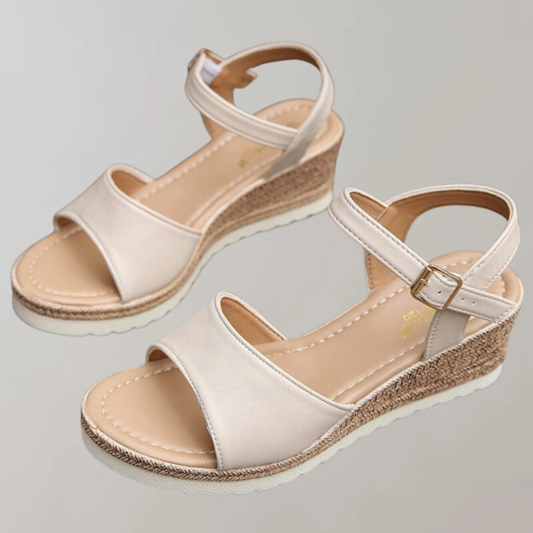 Wedge sandals with an open toe and adjustable strap