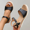 Wedge sandals with an open toe and adjustable strap