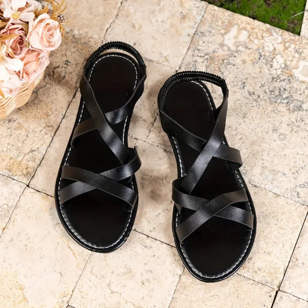 Flat sandals with crisscross straps and elastic back