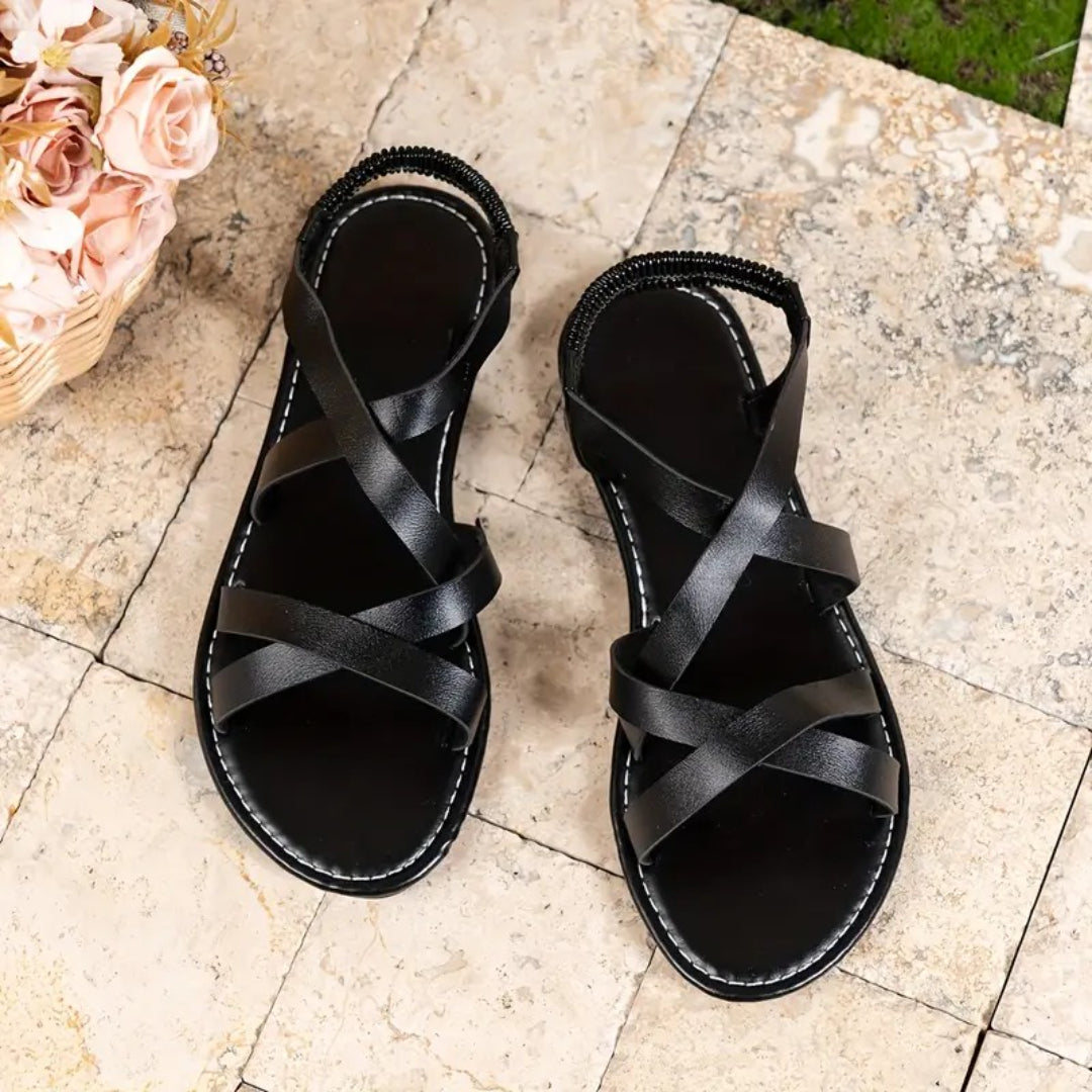 Flat sandals with crisscross straps and elastic back