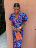 Midi dress with print, puff sleeves, and V-neckline